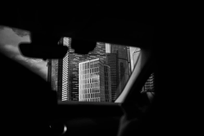 a view of a city through a car window, a black and white photo, by Tobias Stimmer, pexels contest winner, singapore ( 2 0 1 8 ), portrait of tall, chicago, view from inside