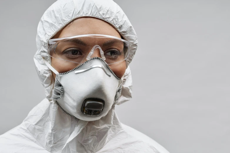 a close up of a person wearing a gas mask, trending on pexels, plasticien, wearing a labcoat, female investigator, cardboard, grey