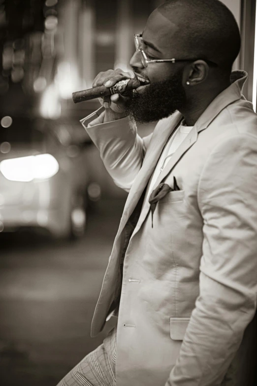 a man in a suit smoking a cigarette, an album cover, inspired by Theo Constanté, pexels contest winner, harlem renaissance, bearded, city street, shot from the side, performing