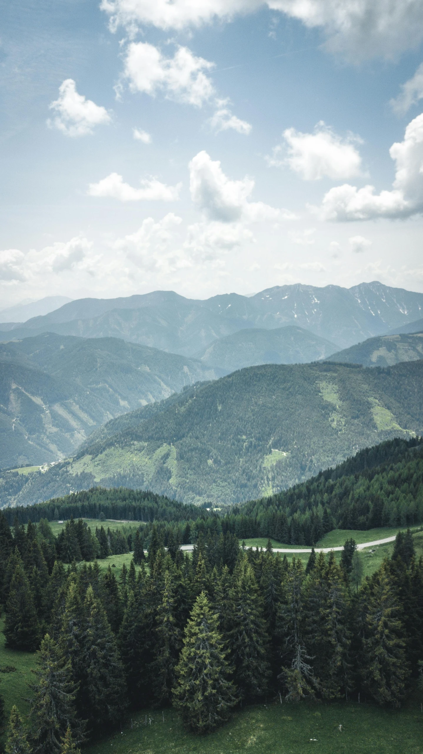 a view of the mountains from the top of a hill, by Tobias Stimmer, pexels contest winner, baroque, forested background, high res 8k, multiple stories, wide high angle view