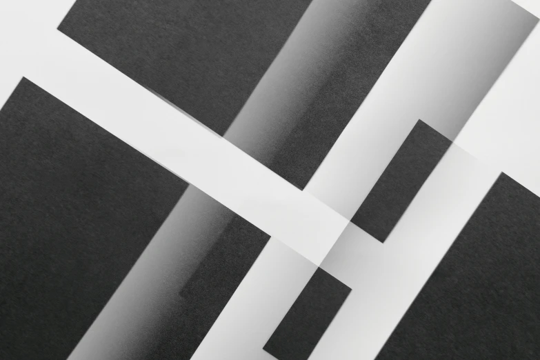 a close up of a piece of black and white paper, inspired by László Moholy-Nagy, pexels contest winner, fog. 3 d, square lines, white ribbon, cross