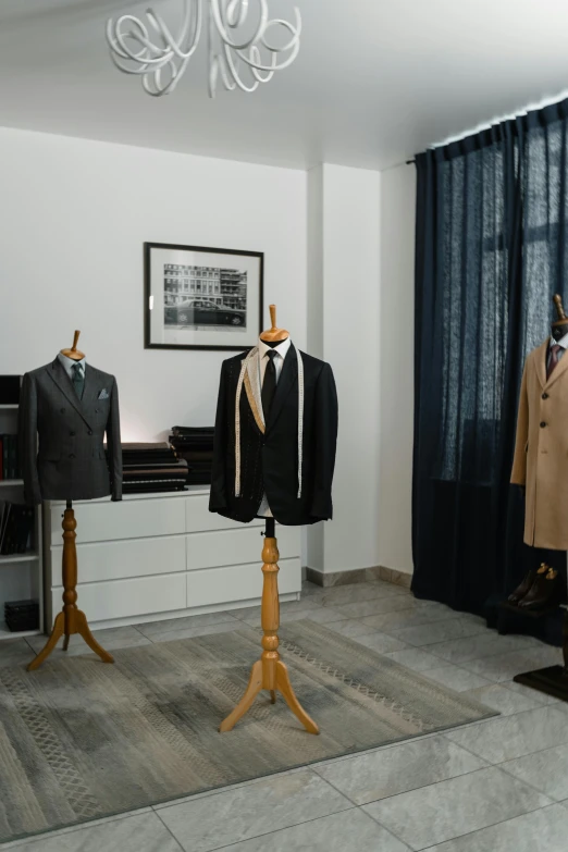 a row of mannequins in a clothing store, a portrait, inspired by Ramon Pichot, private press, costumes from peaky blinders, 3-piece-suit, thumbnail, interior of a small room