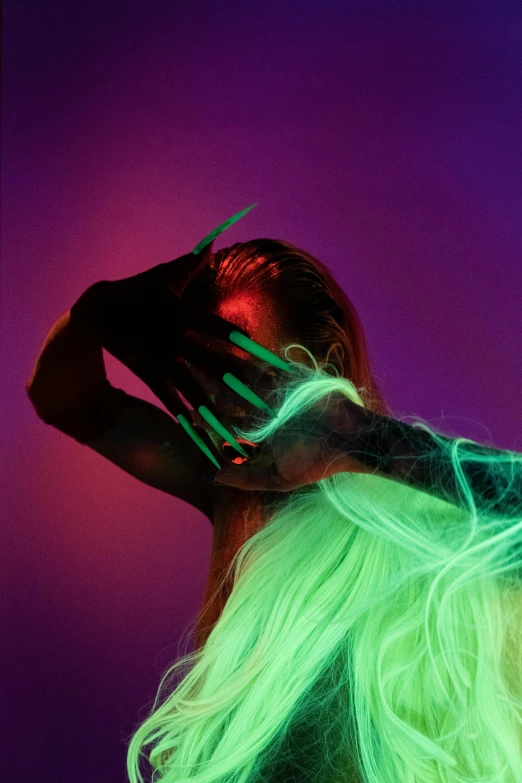 a woman with green hair and neon makeup, an album cover, inspired by Ren Hang, trending on pexels, glowing hands, long glowing hair, hands in her hair. side-view, portrait of ariana grande