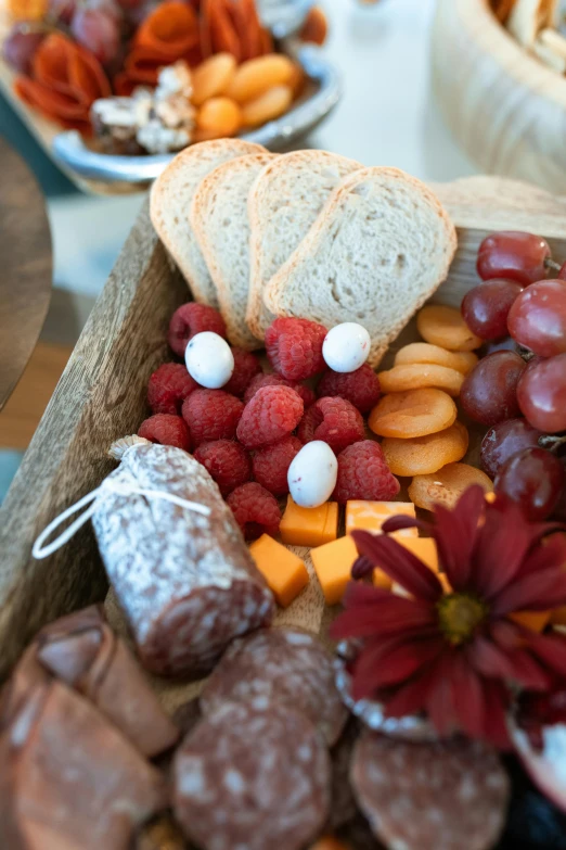 a close up of a tray of food on a table, happening, breads, fruit, hollister ranch, minn