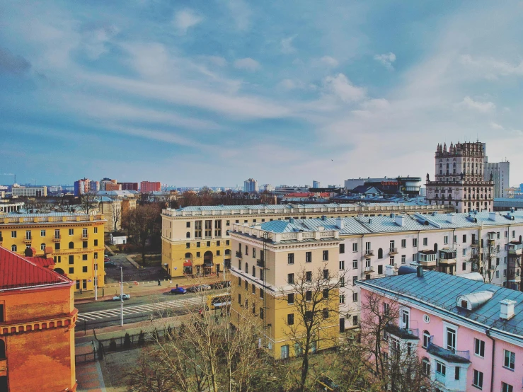 a view of a city from the top of a building, a photo, by Emma Andijewska, pexels contest winner, socialist realism, brightly colored buildings, 000 — википедия, khreschatyk, 2 0 0 0's photo