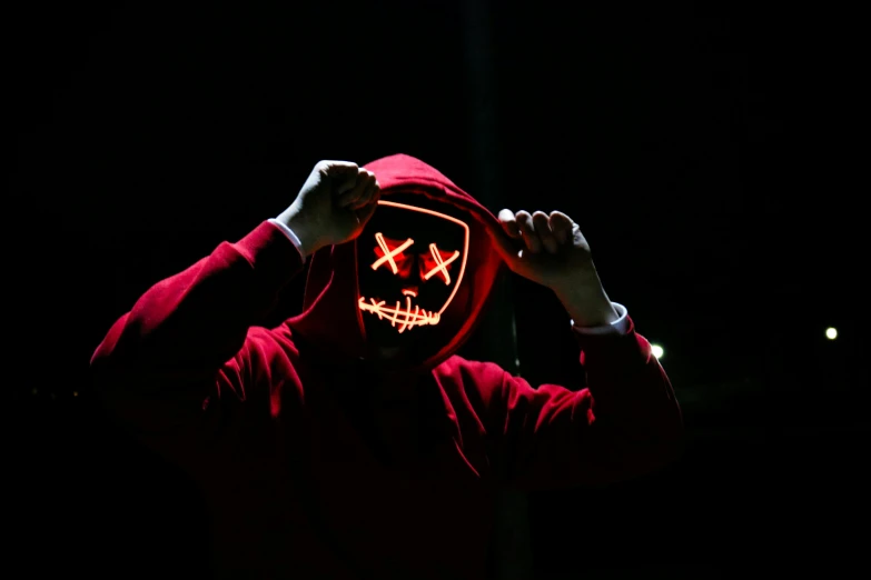 a person wearing a red hoodie in the dark, pexels contest winner, graffiti, metal cat ears and glowing eyes, glowing thing wires, avatar image, slasher
