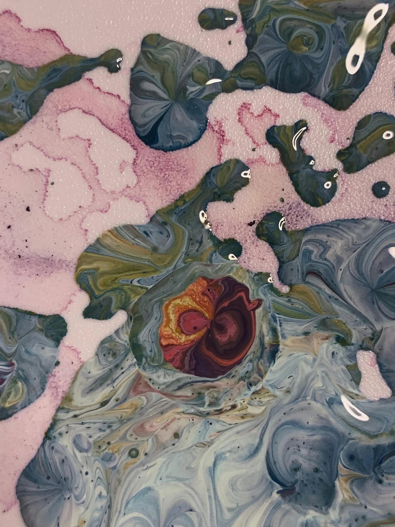 a close up of a piece of art on a table, inspired by Shōzō Shimamoto, unsplash, metaphysical painting, organic ceramic fractal forms, “ femme on a galactic shore, vortex of plum petals, in muted colors