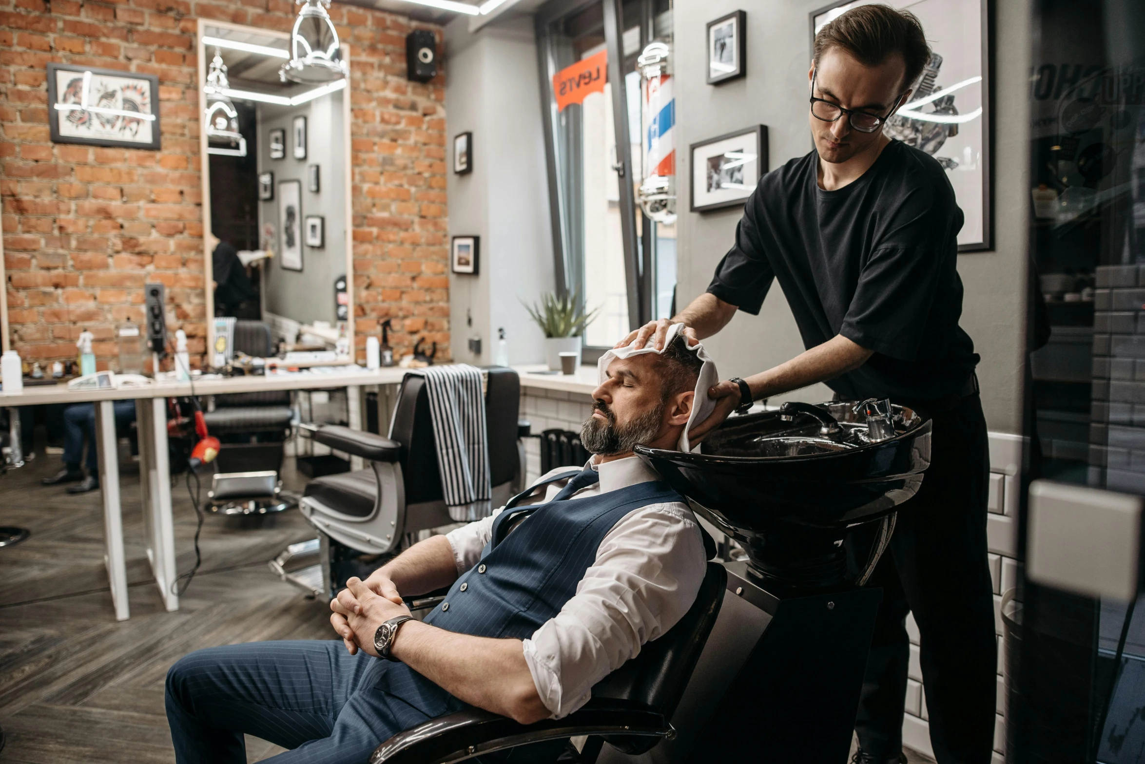 a man getting a haircut at a barber shop, pexels contest winner, lachlan bailey, thumbnail, profile image, commercial