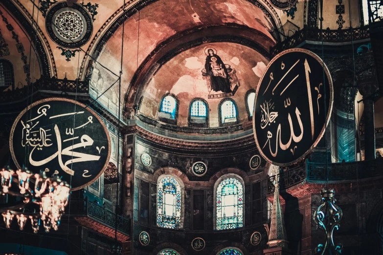 a chandelier hanging from the ceiling of a building, a colorized photo, pexels contest winner, hurufiyya, with great domes and arches, islamic calligraphy, 🚿🗝📝, colorful signs