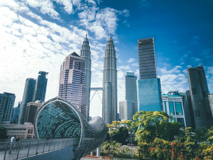 a large elephant statue in front of a city skyline, by Bernardino Mei, pexels contest winner, hurufiyya, malaysia jungle, avatar image, three towers