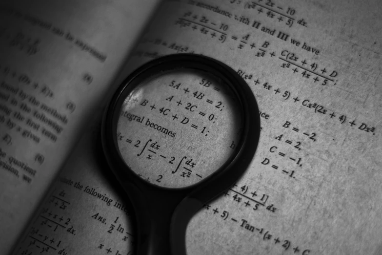 a pair of scissors sitting on top of an open book, a picture, by Aleksander Gierymski, analytical art, math equations, magnifying glass, monochrome, featured