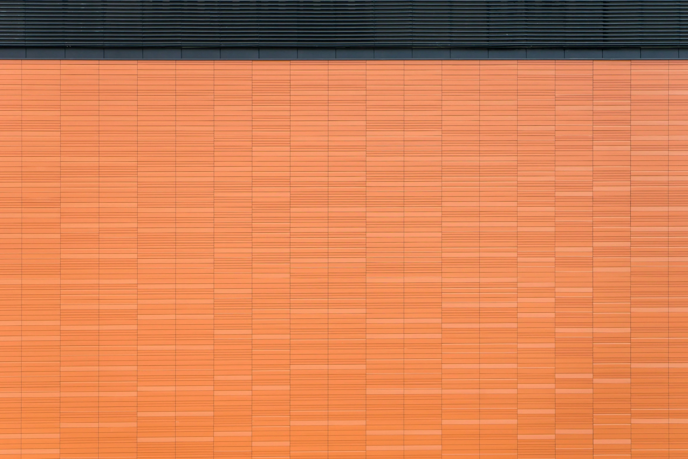 a fire hydrant in front of a brick wall, a minimalist painting, inspired by Andreas Gursky, unsplash, orange and black, metal cladding wall, seen from straight above, lined up horizontally