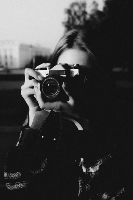 a woman taking a picture with a camera, a black and white photo, ✨🕌🌙, profile picture, ansel ], looking at you