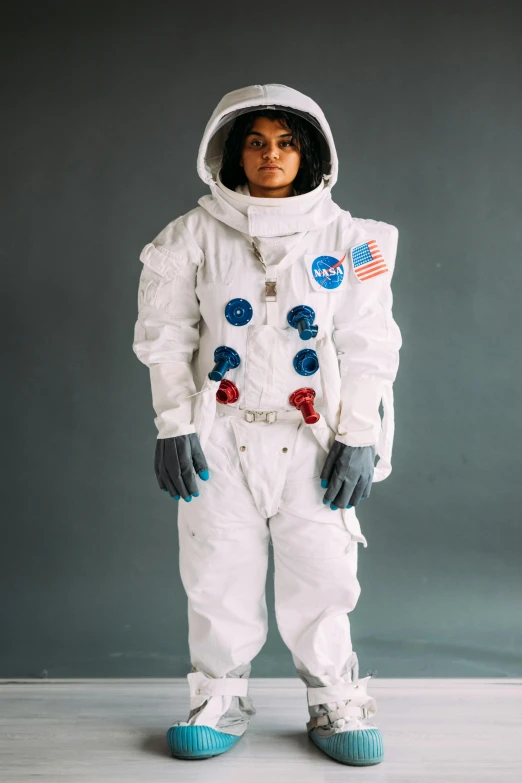 a woman in an astronaut suit posing for a picture, by Alison Geissler, wax figure, 2019, circa 1 9 9 9, sara ali