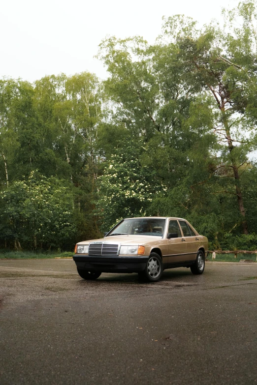 a car is parked in a parking lot, an album cover, unsplash, photorealism, 1990 photograph, mercedes, cardboard, muted colors. ue 5