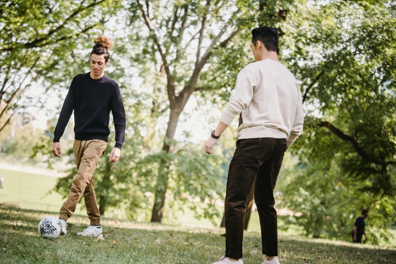 two men are playing soccer in the park, pexels contest winner, renaissance, brown pants, looking at each other mindlessly, thin young male, full body image