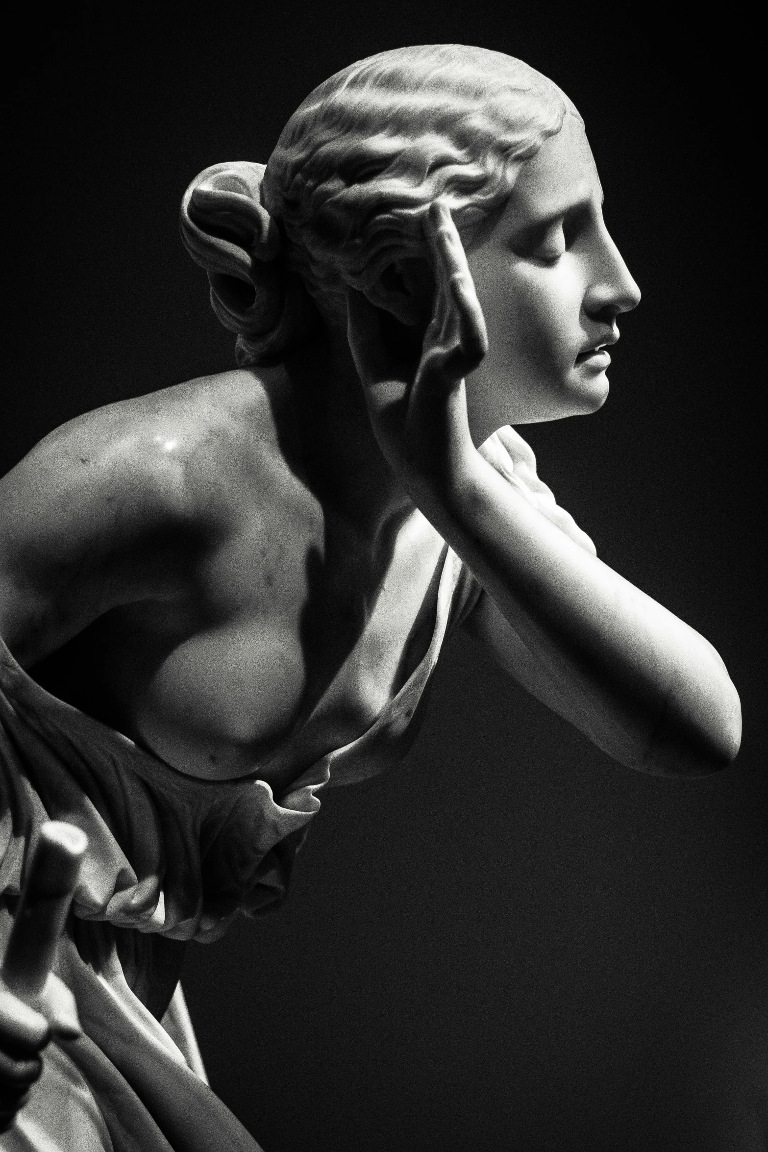 a statue of a woman talking on a cell phone, inspired by Antonio Canova, pexels contest winner, photography of albert watson, made of marble, classical lighting, head and upper body