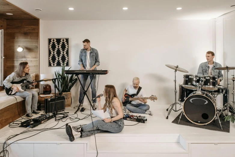 a group of people playing instruments in a room, an album cover, unsplash, light and space, white background, worship, multiple stories, video footage