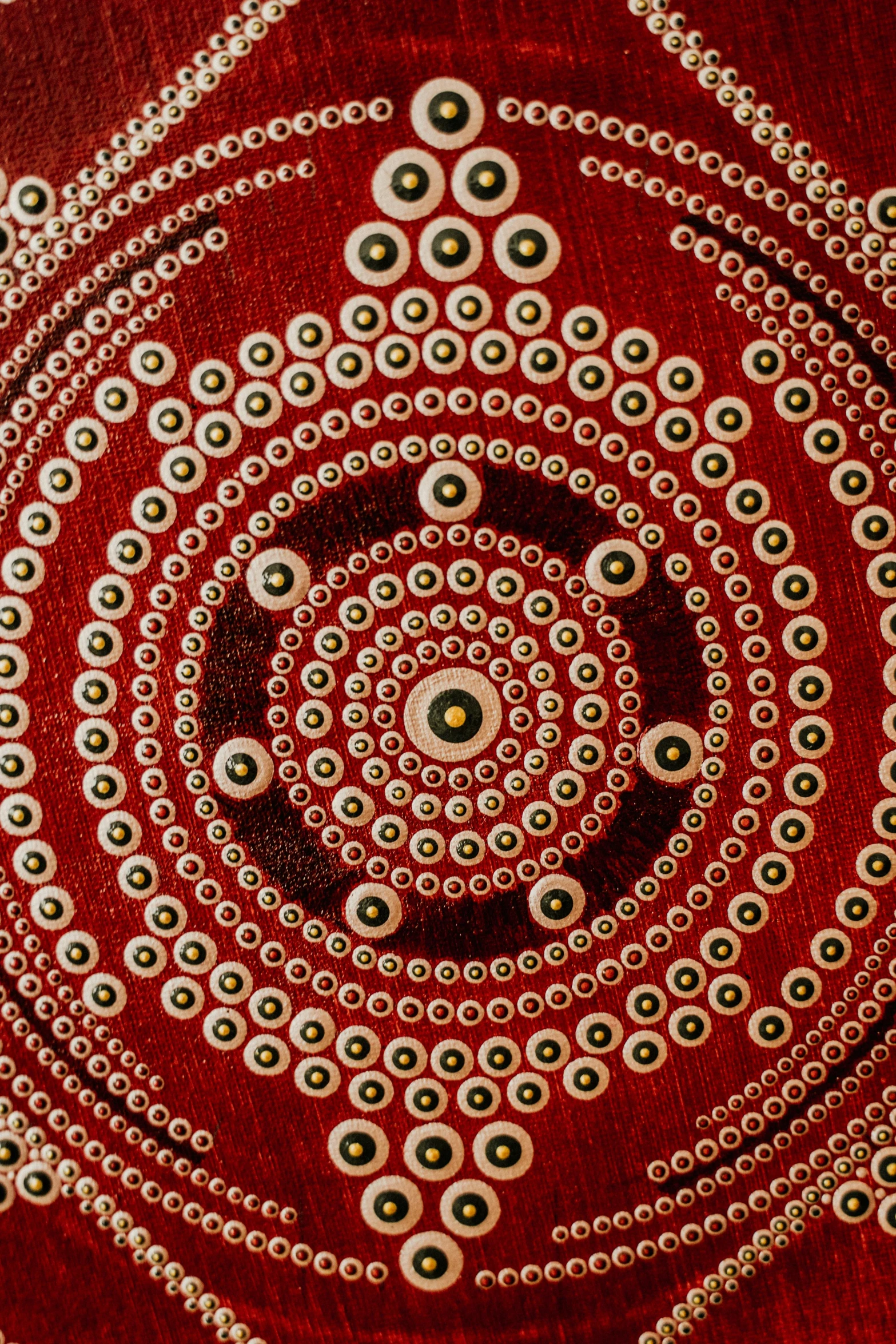 a red rug with a circular design on it, a detailed painting, by Elizabeth Durack, flickr, kinetic pointillism, spiral eyes, uluru, detailed photo of an album cover, mahogany eyes