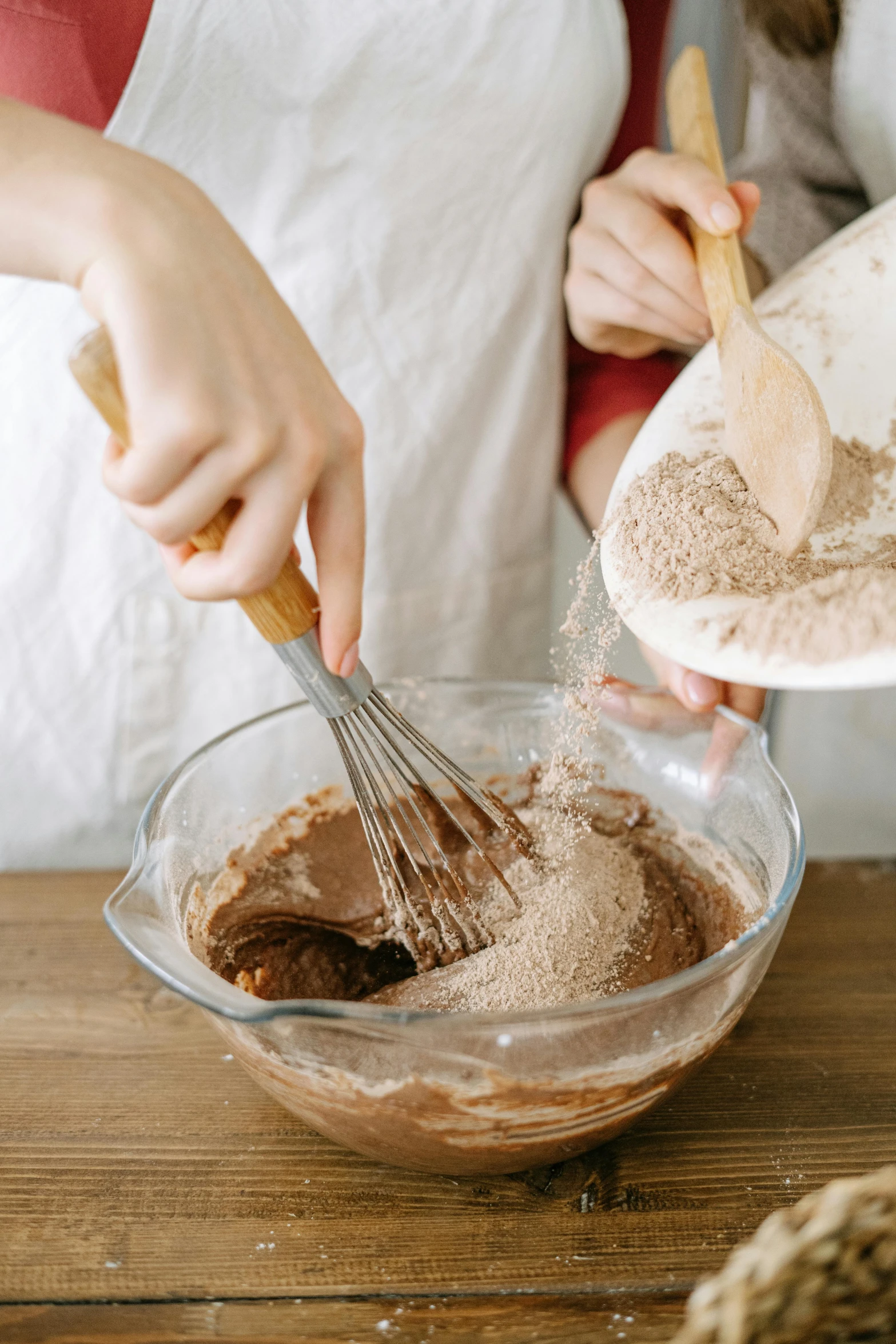 a woman mixing ingredients in a bowl with a whisk, an album cover, inspired by Miyagawa Chōshun, trending on pexels, baking cookies, brown mud, thumbnail, 8l