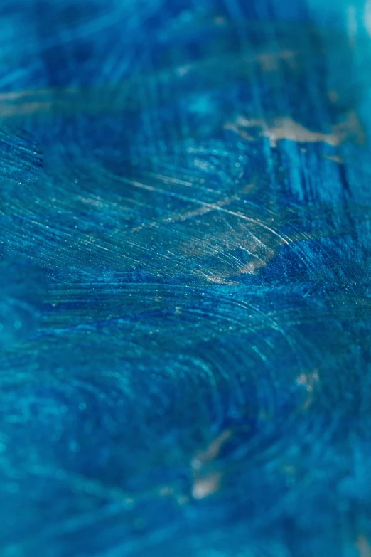 a close up of a surfboard on a body of water, inspired by Umberto Boccioni, unsplash, abstract art, blue translucent resin, gelatine silver process, made of silk paper, detail texture