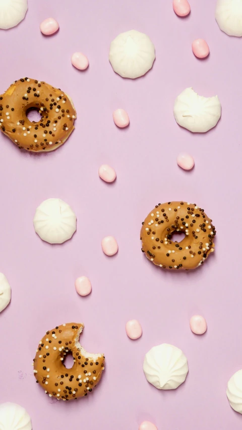a number of doughnuts with sprinkles on a pink surface, by Carey Morris, trending on pexels, lilac, 15081959 21121991 01012000 4k, flying saucers, panel