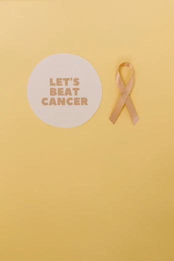 a sticker that says let's beat cancer next to a pink ribbon, pexels contest winner, happening, yellow tint, blank, tanned, ad image