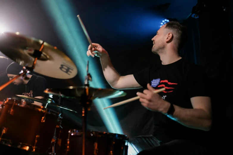 a man that is sitting in front of a drum, profile image, rocking out, close angle, tomasz strzalkowski