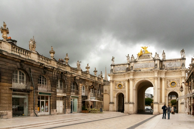 a couple of people that are standing in front of a building, a marble sculpture, by Daniel Gelon, pexels contest winner, baroque, tall golden heavenly gates, overcast, prefecture streets, a wide open courtyard in an epic