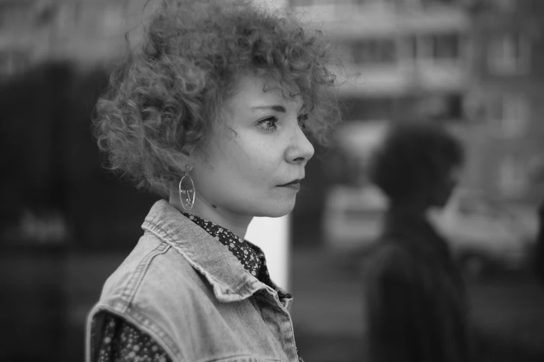 a black and white photo of a woman with curly hair, by Tamas Galambos, pexels, fantastic realism, in moscow centre, sophia lillis, in a square, 15081959 21121991 01012000 4k