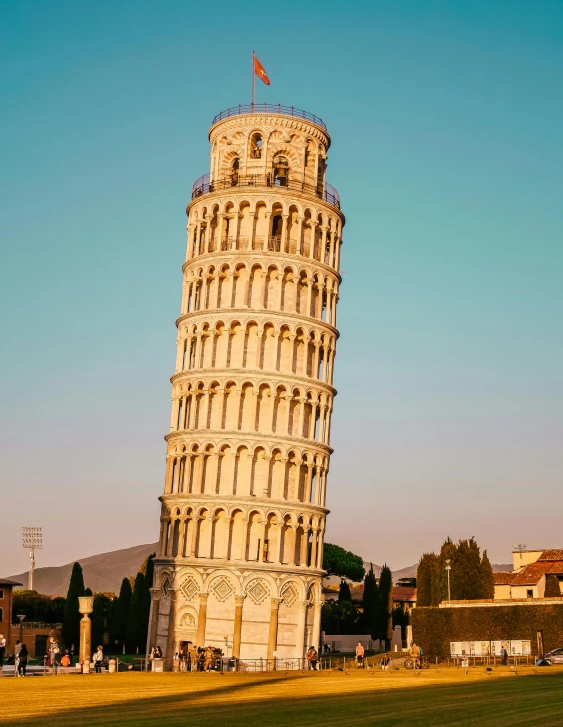 a tall tower sitting on top of a lush green field, by Julia Pishtar, pexels contest winner, renaissance, 🚿🗝📝, square, pasta, lgbtq