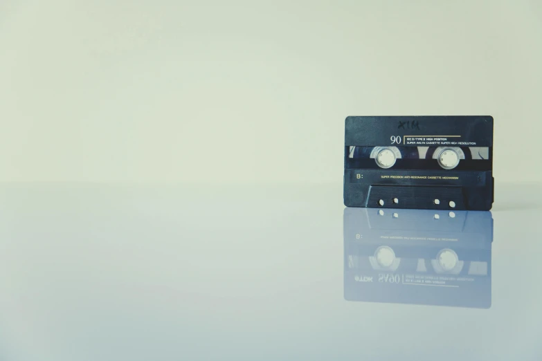 a cassette player sitting on top of a table, unsplash, minimalism, ignant, caustics, rectangle, iso 800