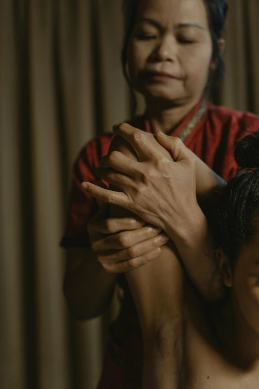 a woman combing a child's hair in a room, unsplash, hurufiyya, film still of manny pacquiao, holding each other hands, indonesia, loin cloth