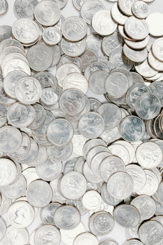 a pile of silver coins sitting on top of a table, thumbnail, iowa, x, may)