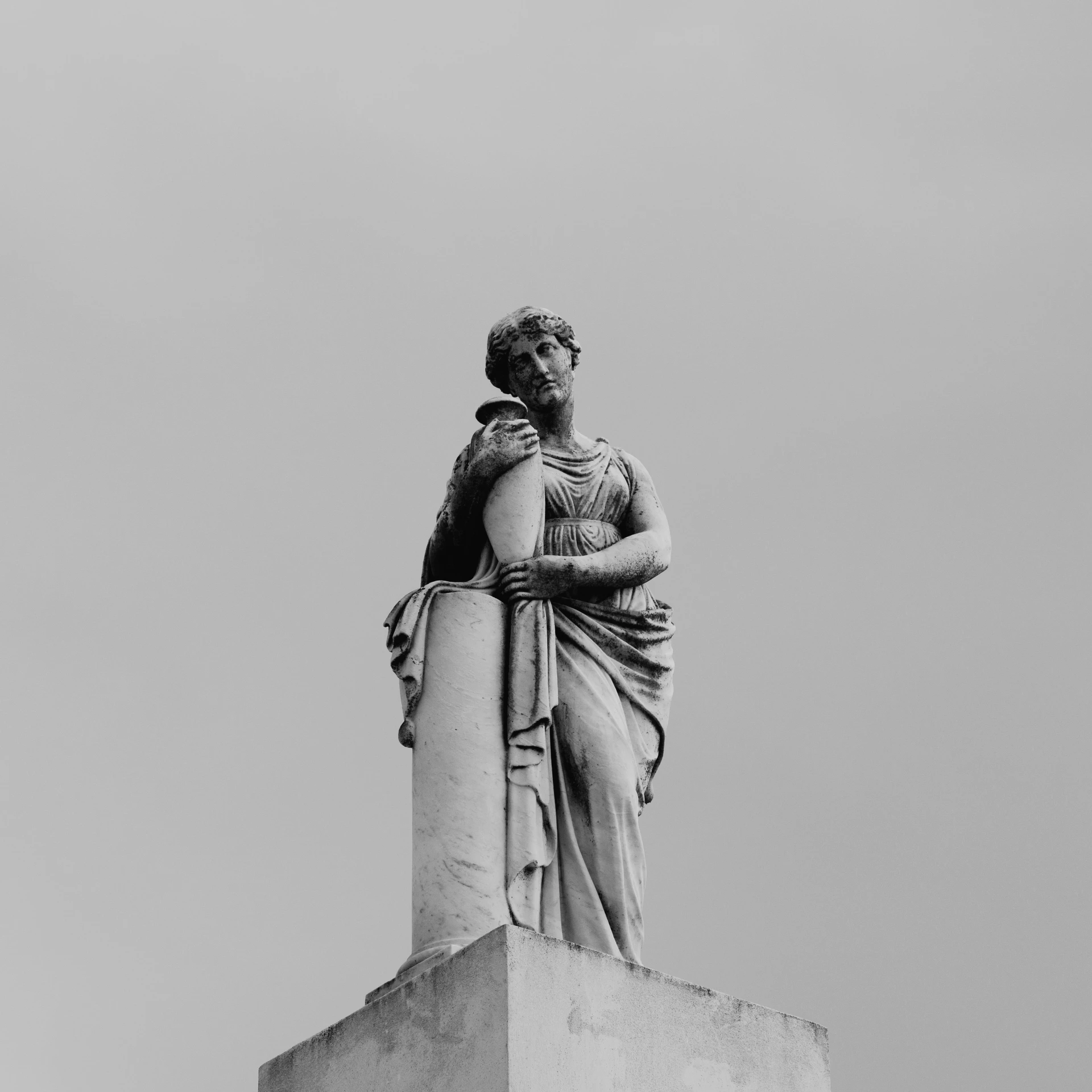 a black and white photo of a statue on top of a building, a statue, inspired by Antonio Canova, pexels contest winner, neoclassicism, holly herndon origami statue, feminine female, cementary, portrait of a old