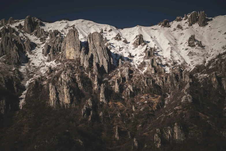 the top of a mountain covered in snow, unsplash contest winner, baroque, sharp cliffs, pyranees, thumbnail, high quality image