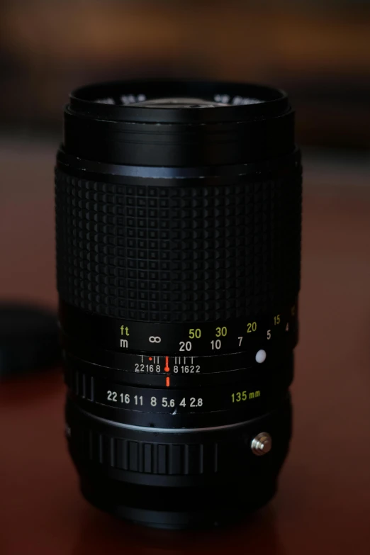 a close up of a camera lens on a table, a portrait, flickr, 1 3 5 mm nikon f / 2, front portrait, f/3.2, on pentax 67