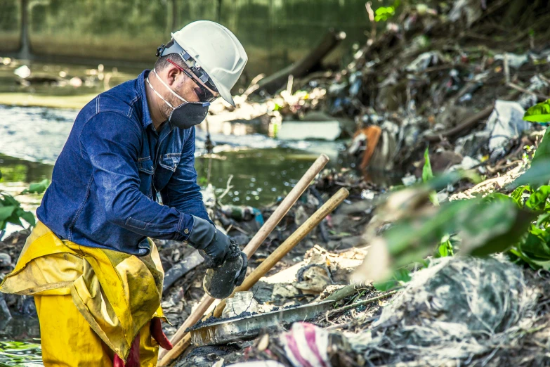 a man in a blue shirt and yellow pants, plasticien, bioremediation, debris spread, profile picture 1024px, urban exploration