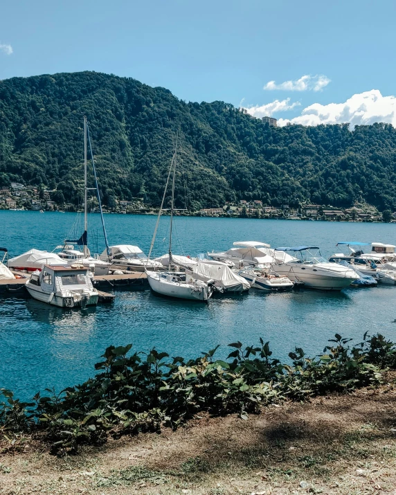 a number of boats in a body of water, picton blue, conde nast traveler photo, parks and lakes, brown