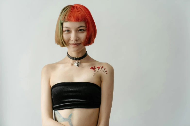 a woman with a tattoo on her chest, an album cover, inspired by Taro Yamamoto, trending on pexels, cyberpunk dyed haircut, a still of a happy, croptop, portrait of asuka langley soryu