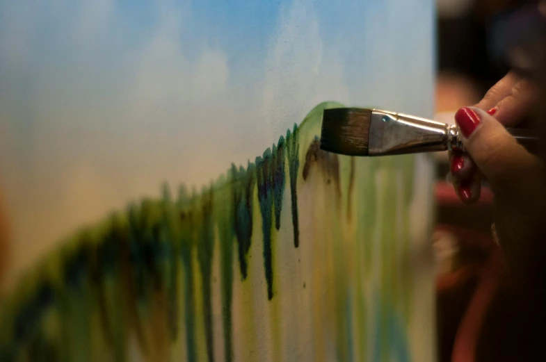 a close up of a person painting on a canvas, a photorealistic painting, pexels contest winner, big brush, leaning towards watercolor, landscape art, subtle depth of field