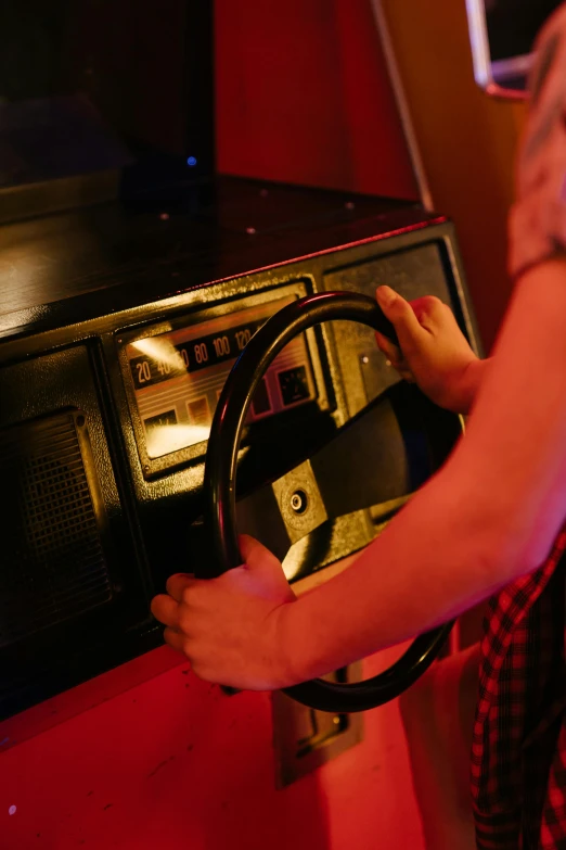 a woman holding a steering wheel in front of a microwave, unsplash, interactive art, bumper cars, retro games, nightclub, knight rider