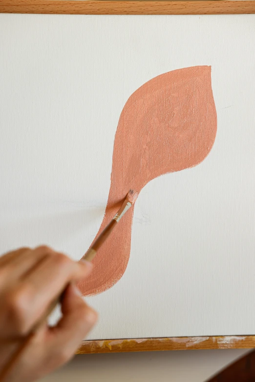 a person painting a leaf on a piece of paper, in shades of peach, high-body detail, full product shot, spoon placed