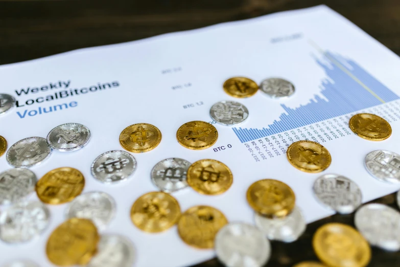 a bunch of coins sitting on top of a table, waveforms on top of square chart, digital asset, pixvy, bitcoin