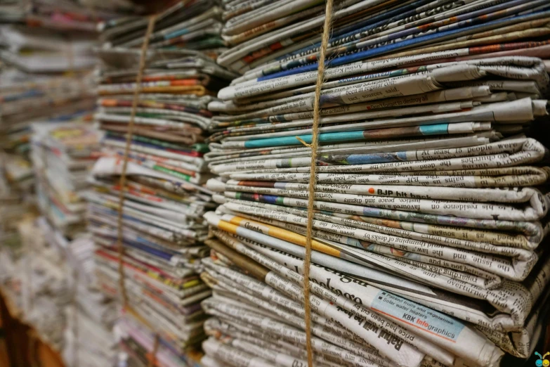 a bunch of newspapers stacked on top of each other, a picture, pexels, private press, hay, recycled, facebook post, avatar image