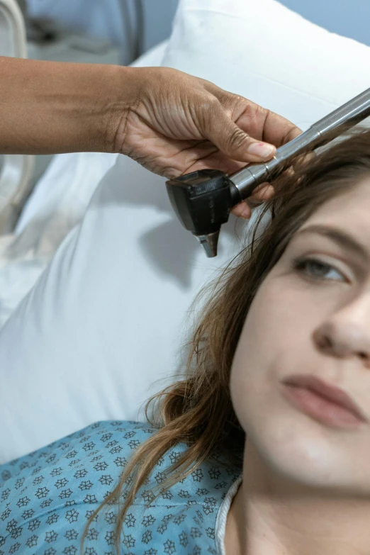 a woman getting her hair done by a hair stylist, an album cover, by artist, shutterstock, renaissance, machine parts embedded into face, with a stethoscope, close up shot from the side, snoring