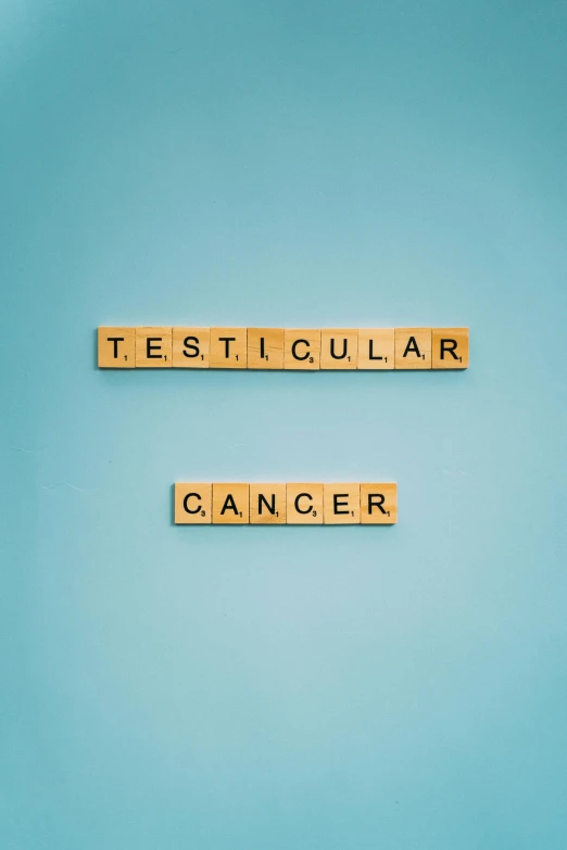 two scrabbles spelling testigular cancer on a blue background, an album cover, tehnicolor, 144x144 canvas, ut 4, viral image