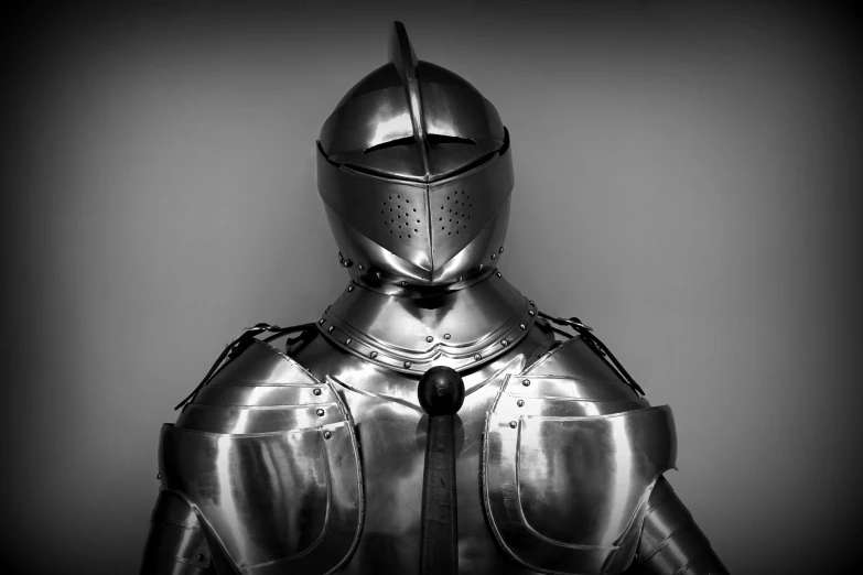 a black and white photo of a knight in armor, an album cover, by Adam Marczyński, pexels contest winner, stainless steal, shiny hi tech armor, historically accurate, realistic armor