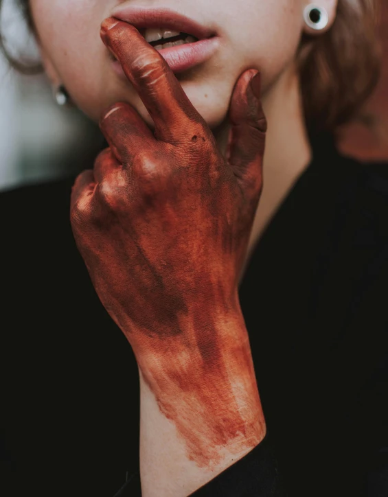 a woman with red paint on her hands, a hyperrealistic painting, trending on pexels, chocolate. rugged, skincare, scp-173, bronze