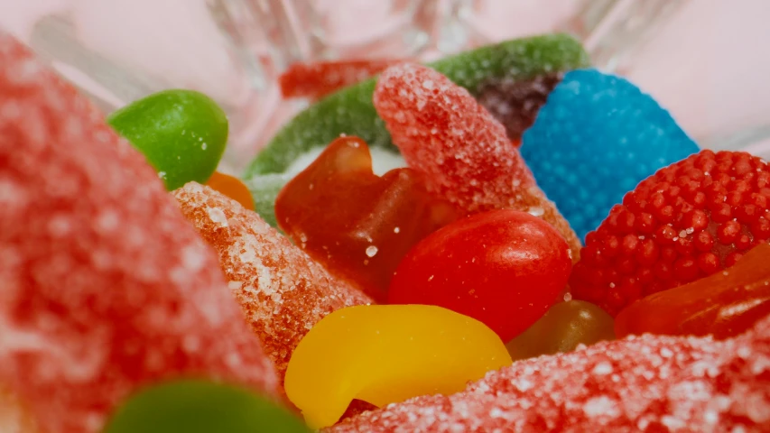 a close up of a bowl of gummy bears, an album cover, pexels, gumdrop bunnies, vintage colours, drinks, medium detail